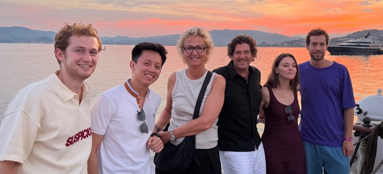 Six members of the IRG team together at sunset in Cannes, 2026